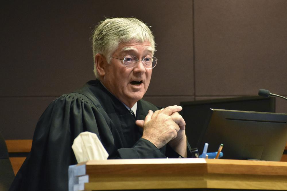 Montana District Judge Michael Moses gestures during a court hearing over a state health department rule that prevents transgender people from changing their birth certificates, Thursday, Sept. 15, 2022, in Billings, Mont. Moses struck down the rule at the conclusion of the hearing. (AP Photos/Matthew Brown)